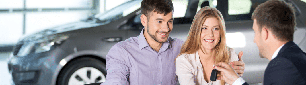 A couple meeting with an automotive financial expert.