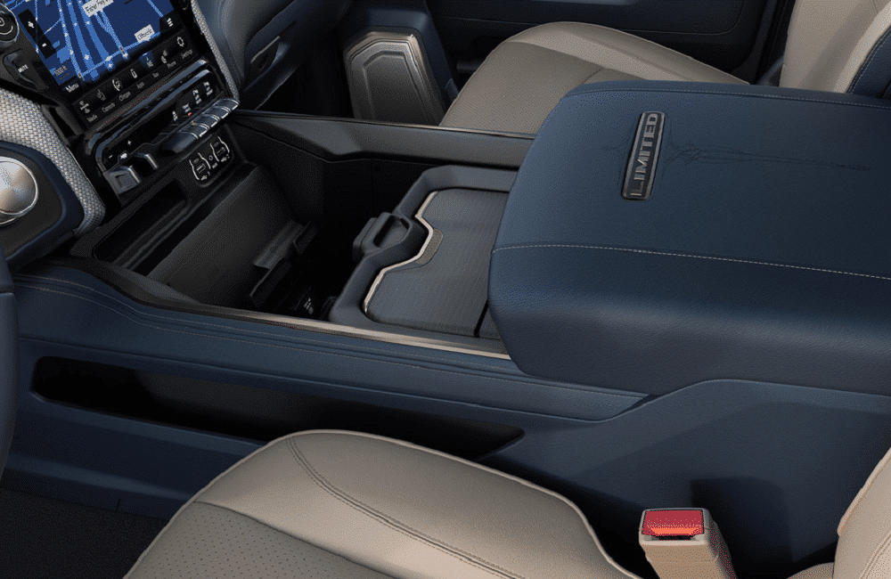 Center console and dashboard of a luxury vehicle interior with navigation display, blue leather accents, and "Limited" label.