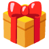 Boîte cadeau jaune festive avec un nœud rouge, symbolisant une célébration ou une occasion spéciale.